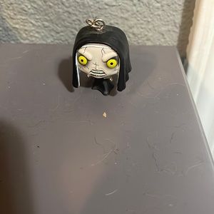 This is a horror keychain it is the nun from the conjuring